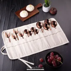A lifestyle shot of a beautiful copper cutlery set in its travel pouch. I've included food items like bao and grapes to show the product in a realistic use-case scenario.