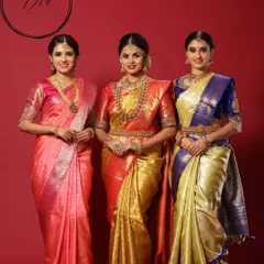 A group portrait showcasing a variety of traditional South Indian bridal looks. From the fully decked-out bride in the center to the elegant bridesmaids, this image shows my ability to style for an entire bridal party.