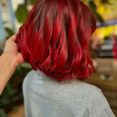 Bringing the fiery vibes with this vibrant red. A bold color paired with a chic bob haircut is a power move that never fails. (No filter)