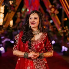 Pure joy and glamour for a reception night. This look features soft, curly hair and luminous makeup that shines bright, perfect for celebrating and making unforgettable memories.