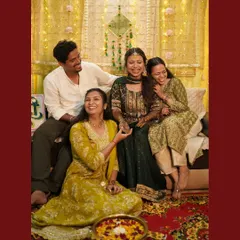 The Mehendi ceremony is a celebration with everyone you love. Here, the bride is surrounded by her closest friends and family, sharing stories and laughter. I make sure to capture these group dynamics and candid moments.