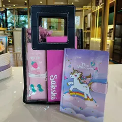 A unicorn-themed hamper for kids. This gift set includes a unicorn diary and a personalized pouch, all packed in a transparent bag.