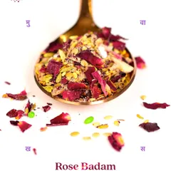 A spoonful of my Rose Badam Mukhwas, highlighting the vibrant colours and textures of the all-natural ingredients. It's a refreshing and rejuvenating blend of fragrant rose, crunchy almonds, and digestive spices.