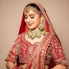 The serene beauty of a bride on her special day. This shot captures the soft, blended eyeshadow and the gentle smile, reflecting the calm confidence that comes with knowing your makeup is perfect.