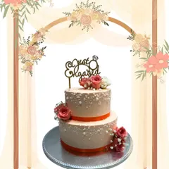 Celebrating the beginning of a new journey, this two-tier engagement cake is both classic and elegant. I used delicate sugar pearls and fresh roses to create a romantic look, all baked fresh to order for the happy couple's special day.