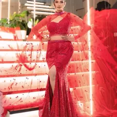 For your cocktail or reception, we love creating looks that are pure glamour. This stunning red mermaid gown is paired with sophisticated makeup and a sleek hairstyle, ensuring you own the spotlight all night long.