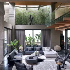 To bring nature inside, I designed this double-height living space around a central green courtyard. The large glass walls and open layout blur the line between indoors and outdoors, creating a sanctuary of calm and light.