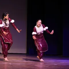 Two performers in perfect sync during a folk dance routine. I choreograph duets and group numbers that ensure every dancer feels confident and shines on stage.