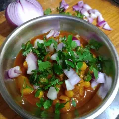 Narkol diye Ghugni, a yellow pea curry with coconut, ready to be packed for patrons. This snack reminds me of the 'melas' (fairs) in Calcutta, where it's enjoyed with toasted bread.