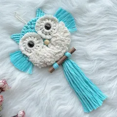 This bright sky-blue and white owl is another one of my favorite color combinations. The dark wooden beads for the eyes really make them pop.