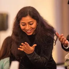A guest's hands fly up in disbelief. It's these physical, involuntary reactions that show the true impact of a magical moment.