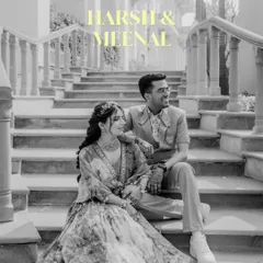 A black and white portrait of the couple, set against the grand staircase of their wedding venue. The yellow text overlay adds a modern, artistic touch to this classic shot.