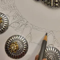 Every heirloom begins as a whisper on paper. Here, you can see my hand-drawn sketch next to the finished components, showing how I translate imagination into tangible ornaments. This is the first step in our bespoke journey together.