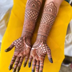 This full-hand and forearm design showcases our expertise in symmetrical patterns, combining checkerboard fills with classic floral and paisley elements for a rich, balanced look.