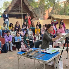 An instructor gives a live watercolor demonstration during our outdoor session. These events are a great opportunity for students to learn new techniques in a real-world setting.
