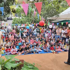 No crowd is too big. Here I am entertaining a large audience at an outdoor community event in Bangalore. My shows are designed to capture the attention of everyone, from the kids sitting up front to the parents in the back.