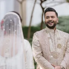 She walked in, and time slowed. He looked up, and in that tiny moment, they both just knew. This is the groom's first look, a priceless, candid reaction of pure joy and adoration.