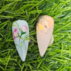 Beautiful floral nail art painted by our students. They learn to create depth and dimension using simple brush strokes and color blending techniques.
