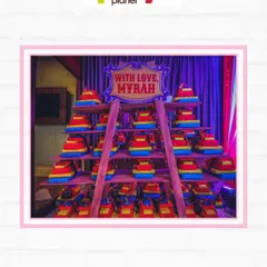 A creative display of party favors at a circus-themed event, stacked high to add to the festive carnival atmosphere.