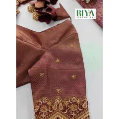A close up of the sleeve of the brown Muhurtham blouse. You can see the detailed Zardosi work creating traditional motifs, finished with a border of delicate pearls. This level of craftsmanship is what makes a bridal blouse truly special.