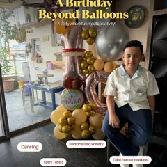 A birthday boy sits proudly next to his balloon arrangement, highlighting that our parties are more than just pottery; they are a full-fledged celebration.