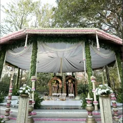 For this wedding, we constructed a divine space right in the middle of nature. The mandap was designed to feel like a serene temple, complete with idols and traditional floral arrangements, blending spirituality with natural beauty.