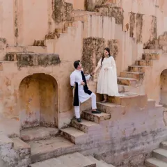 Our pre-wedding shoots are about telling your story in a beautiful setting. This candid moment, captured at a historic step-well, shows our approach to creating natural, romantic images that reflect your personality against a stunning architectural backdrop.