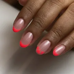 These tips are made to steal hearts. I updated the classic French with a fun twist by shaping the neon pink tips into little hearts.