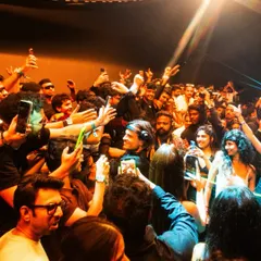 Argy surrounded by fans, taking a selfie from the DJ booth. We create intimate moments even at our largest shows.