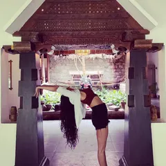 I stand before what is with an open heart. A standing backbend in a beautiful architectural frame, showing how yoga can be practiced anywhere to open the heart and spine.