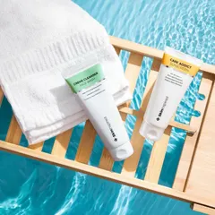 A serene, spa-like scene created using our in-studio water tank. We placed these skincare products on a wooden bath caddy over clear blue water to evoke a sense of calm and relaxation.