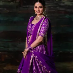 My work includes vibrant fashion photography for ethnic wear. This shot captures the rich color and intricate embroidery of a purple bridal lehenga, making it ideal for brand lookbooks or a model's traditional portfolio.