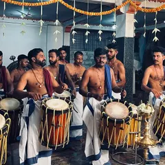 My team of artists, dressed in traditional mundu, ready to begin a performance. The focus and unity you see here are what make our temple Melams so powerful and moving.