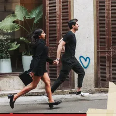 A playful run through the city streets. I love capturing dynamic, in-motion shots that feel energetic and full of life for pre-wedding photography.
