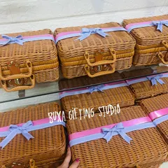 These classic brown wicker baskets with handles make for beautiful and sturdy bridesmaid hampers. I adorn them with soft ribbons to match the wedding theme.