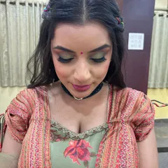 A close-up of the glam Mehendi makeup, showing the blend of green and gold eyeshadow that makes a bold statement.