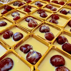Our Kala Jamun served with Basundi. These dark, rich jamuns are soaked in a creamy, thickened milk sauce, offering a luxurious twist on a classic Indian sweet.