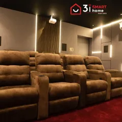 A side view highlighting the premium brown recliners and the integrated wall lighting. The design ensures that even the air conditioning unit is discreetly placed to not interfere with the aesthetic.