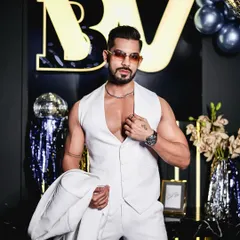 Another look at the all-white waistcoat and trousers. The fit is impeccable, designed to flatter the physique and create a powerful silhouette for a themed party or special event.