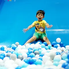 The excitement is real! This little adventurer is captured mid-air, showing the pure energy and joy that my slides and ball pits bring to every child's visit.