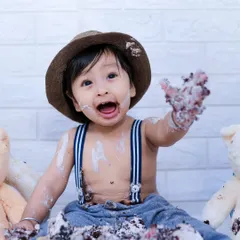 Nothing says "Happy First Birthday" like a cake smash! We capture the pure, messy joy as your little one dives into their first cake, creating hilarious and sweet memories.