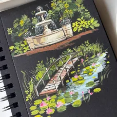 A sketchbook spread featuring two serene nature scenes painted with gouache on black paper. One shows a garden fountain, and the other a wooden bridge over a lily pond, inspired by Monet.