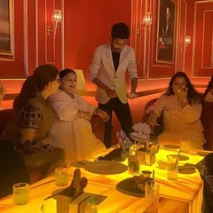 Another angle from the same private party, showing the guests' captivated reactions. My goal is to make everyone in the room feel included in the experience.