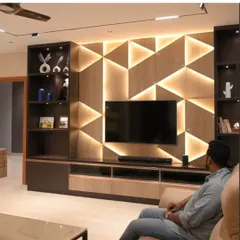 Lighting can also be a design element. For this living room, we integrated backlighting into a geometric wooden wall panel, creating a stunning visual centerpiece that is also fully dimmable and controllable.