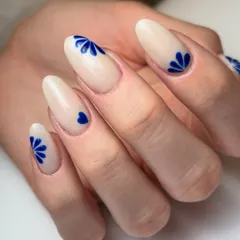 A little piece of art for a client traveling to Switzerland. This design features minimal, elegant cobalt blue floral patterns on a creamy nude base.