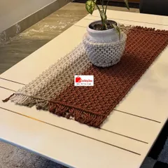 My ombre-style table runner is a true work of art. The colors blend beautifully from light to dark, and it's shown here with a matching macrame-covered pot.
