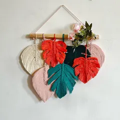 This is a closer look at a finished Monstera leaf wall hanging. By combining different leaf shapes and a mix of my colored and natural cords, you can create a truly unique piece of botanical art.