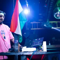 Pointing to the crowd, sharing the patriotic energy during a Republic Day themed club night.