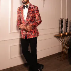 A full-length shot displaying the complete Cantaloupe Tuxedo ensemble. The striking jacket is balanced with classic black trousers and formal shoes, creating a look that is both daring and perfectly composed.