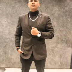 A shot from a professional photoshoot. I believe in presenting a stylish and confident image that matches the quality of my service.